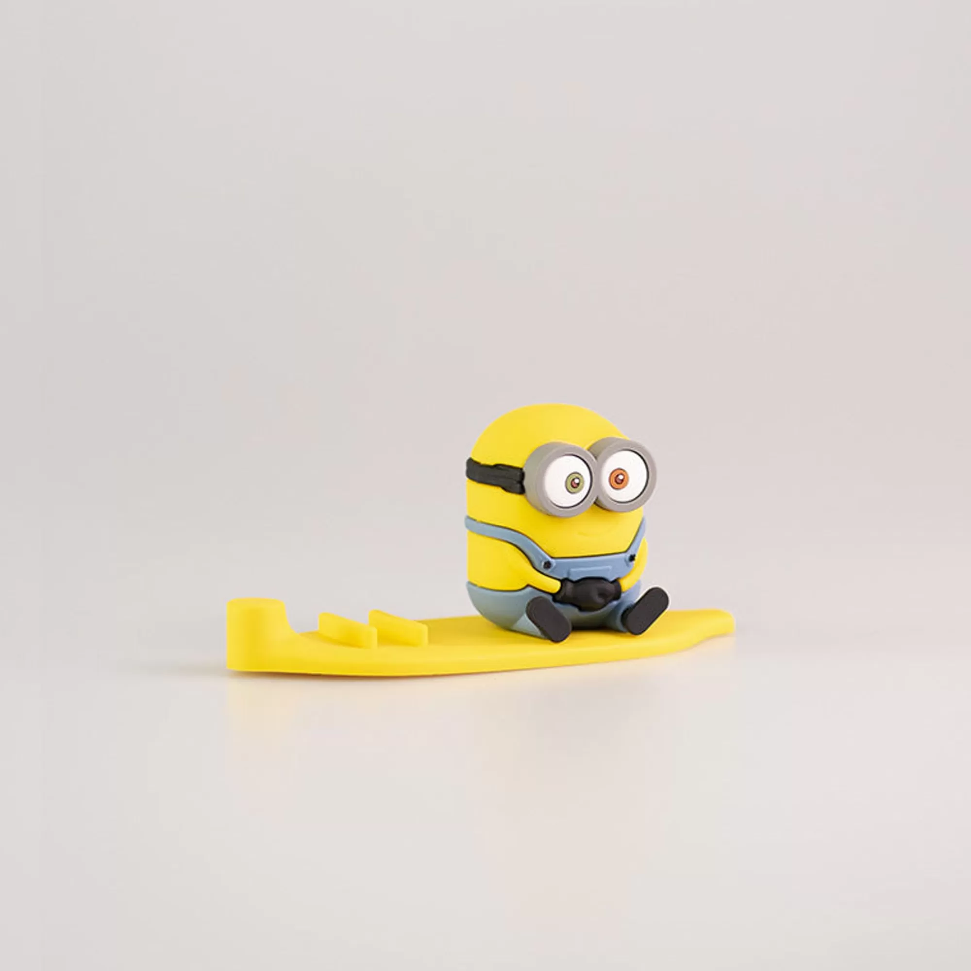 MINISO Accessori Digital-Poggia Cellulare Minions - Seduto
